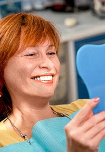 A woman smiling after Cosmetic dentistry in Cabana Colony
