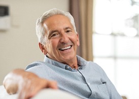 Smiling senior man enjoying benefits of dental implants