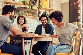 Group of friends enjoying coffee in restaurant
