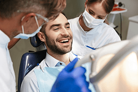 a patient visiting his dentist for a smile makeover