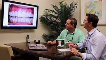 Dentists examining patient case