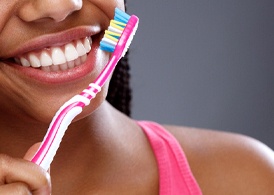 Closeup of patient brushing their teeth to prevent a toothache in Juno Beach