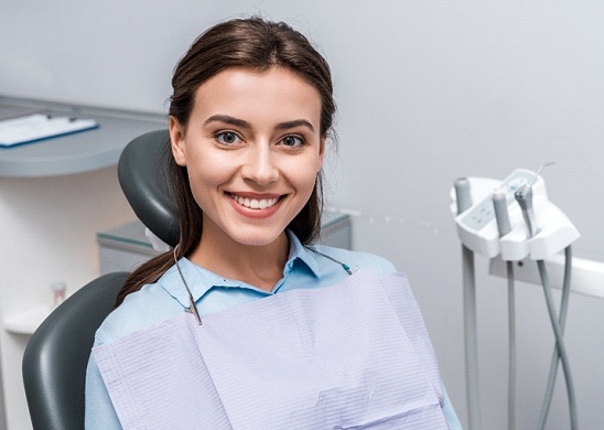 Happy dental patient smiling after root canal in Juno Beach