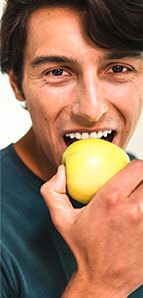 Man eating an apple