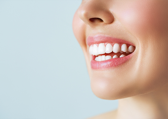 A male patient undergoing teeth whitening treatment