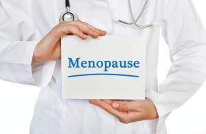 doctor holding menopause sign