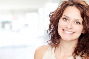 woman brunette smiling with gorgeous teeth