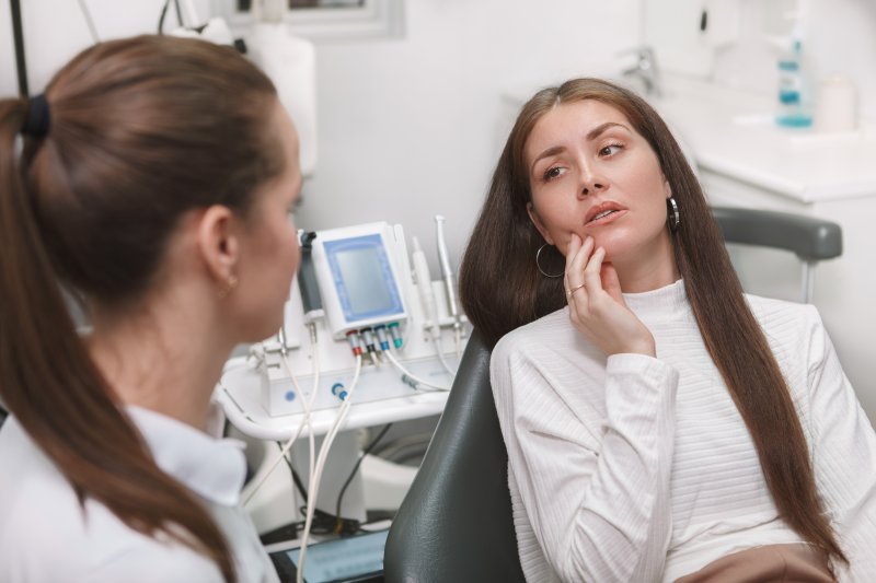 woman having emergency dental visit in Juno Beach 