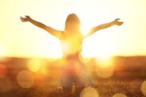 Woman getting a sufficient amount of vitamin D via sunlight.