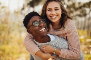 a couple with beautiful smiles while dating