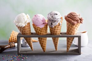 Four ice cream cones on a rack