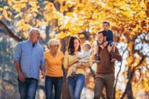Three generations of a family walking and smiling